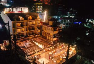 Hotel Willow Banks in Shimla surrounded by lush greenery and mountains
