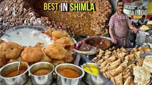 Colorful street food stalls serving local snacks in Shimla hills