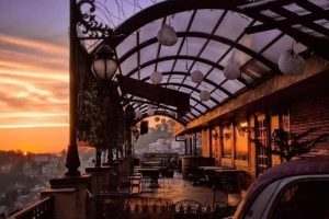 SkyBar rooftop lounge with scenic mountain views and cozy seating